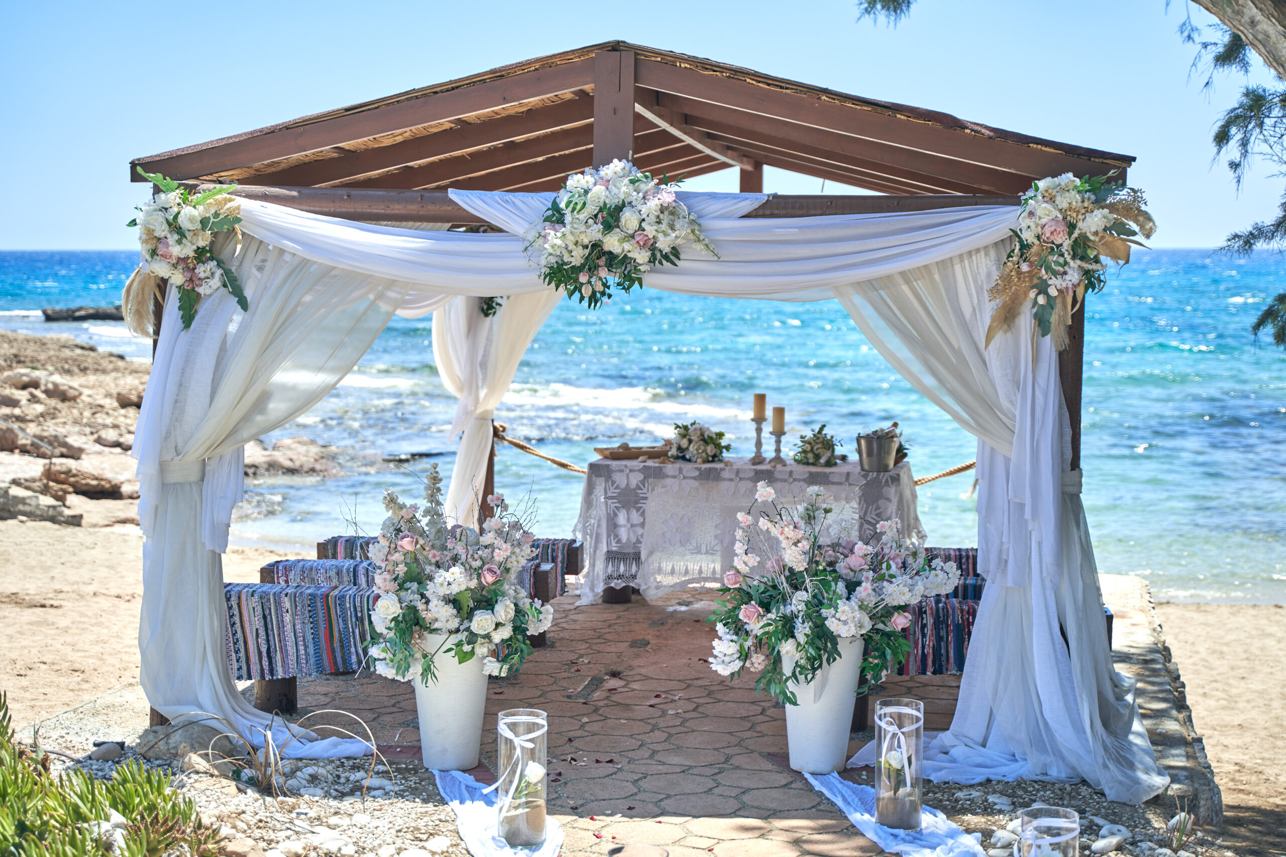 Ammos Kampouri beach wedding ceremony Ayia Napa Cyprus white flower decorations
