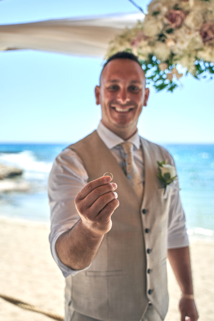 groom with ring Ammos Kampouri Ayia Napa beach wedding ceremony