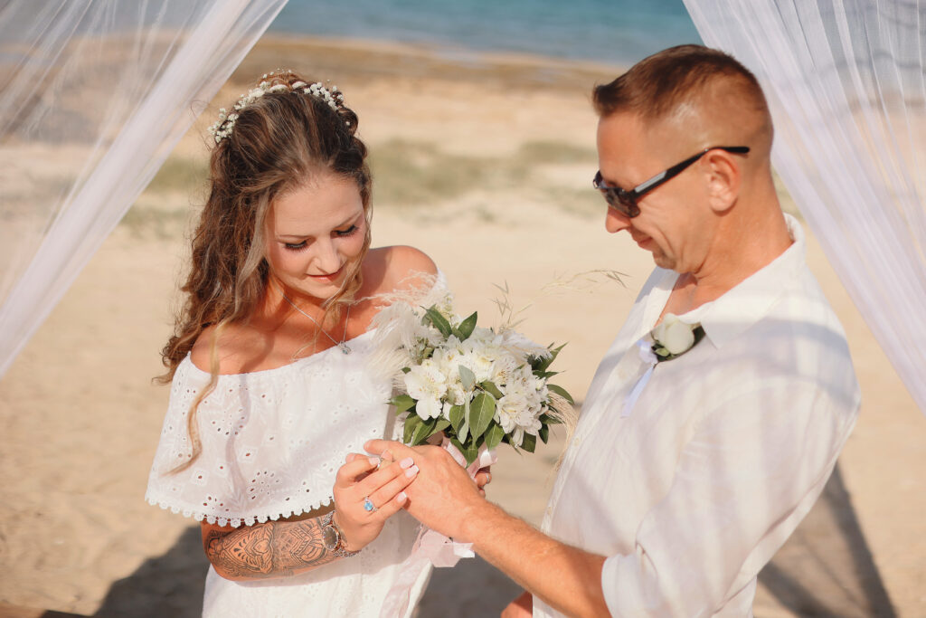 wedding ring exchange Ayia Triada beach ceremony