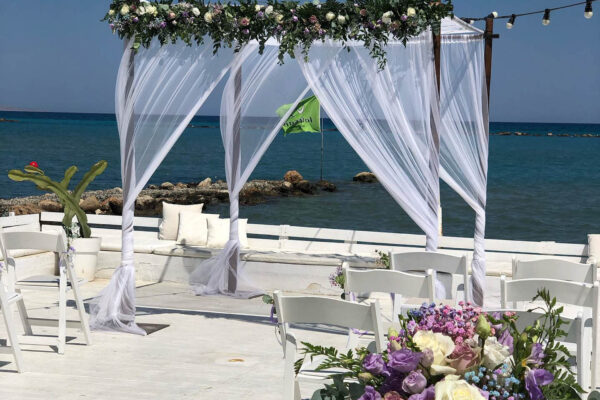 Nautical club wedding venue Larnaca package fresh flower bamboo arch decoration hire rental chuppah