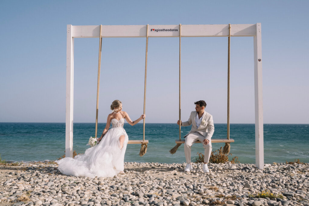 bride and groom at swings beach Cyprus wedding