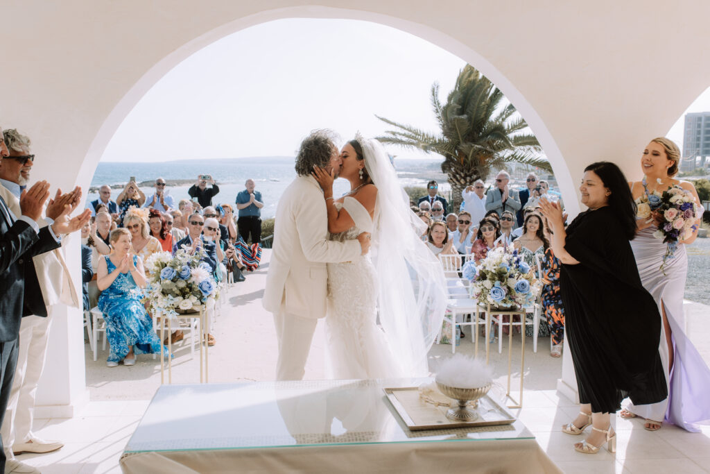 bride and groom first kiss wedding Cyprus beach