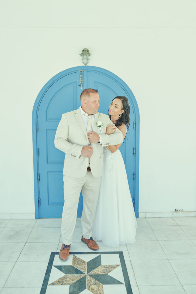 bride and groom photoshoot white blue classic church at Ayia Thekla in Cyprus