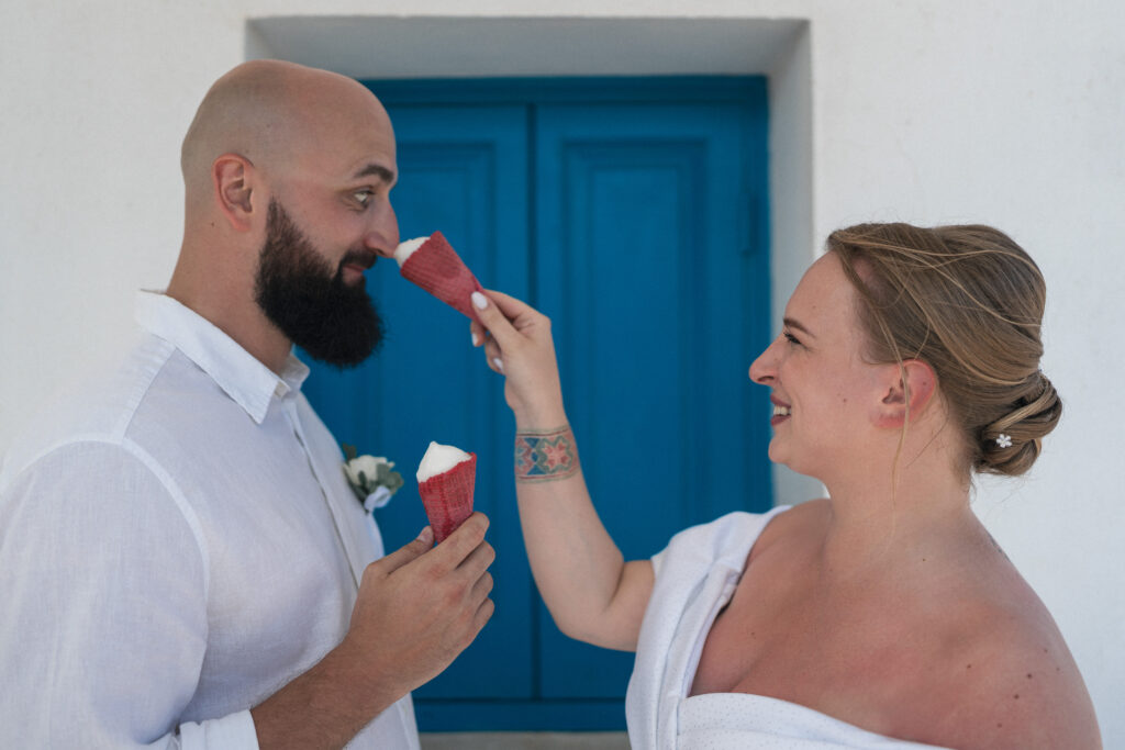 74101295-Edit_www.happyimagescyprus.com bride and groom having fun with ice cream during their private wedding photoshoot at Ayioi Anargiroi Church in Cyprus