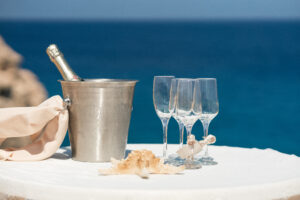 wedding champagne and glasses with a sea backdrop at Corrali Blue lagoon wedding near Ayia Napa