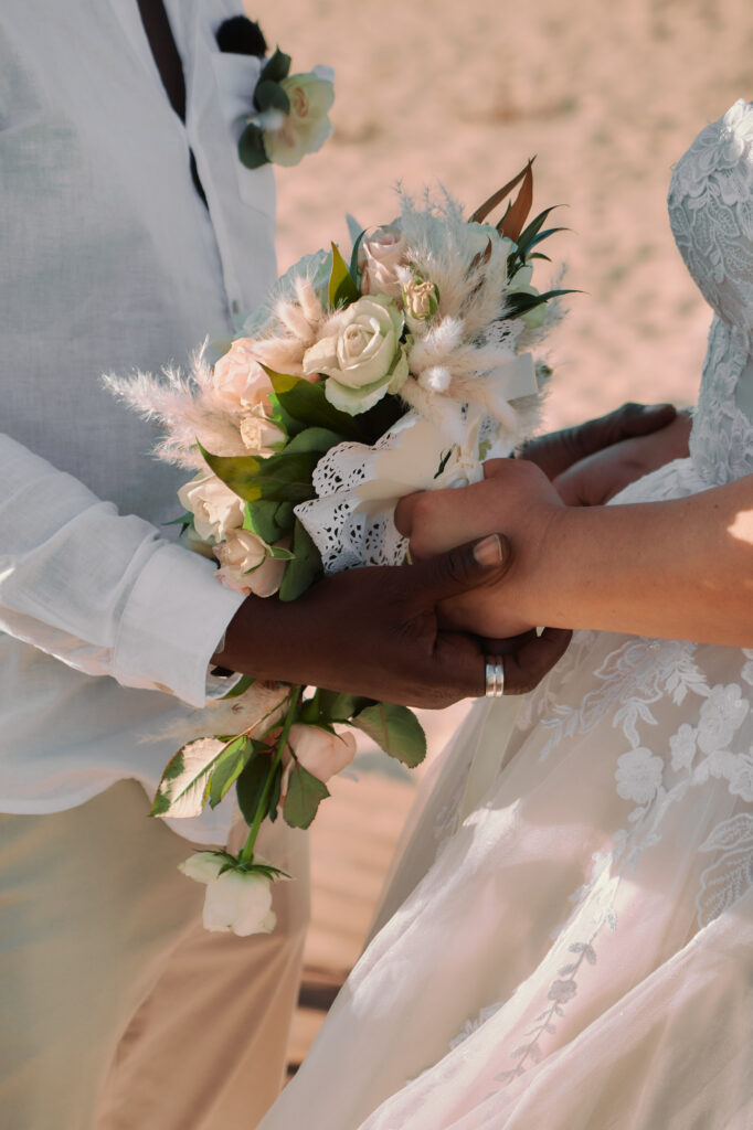 the most romantic wedding photograph of couple holding hands after saying Yes