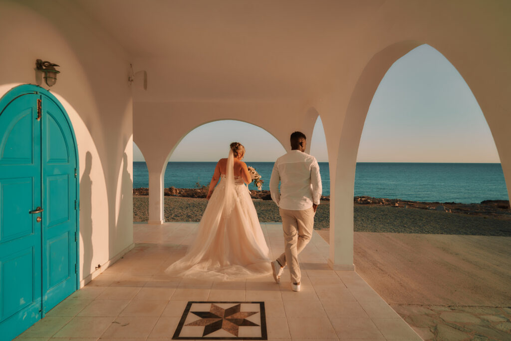 romantic sunset wedding photoshoot at Ayia Thekla church. The couple is enjoying their elopement wedding ceremony in Cyprus