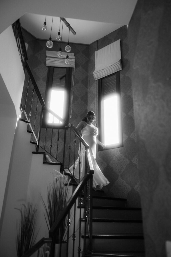 bride walking down the stairs for her wedding first look