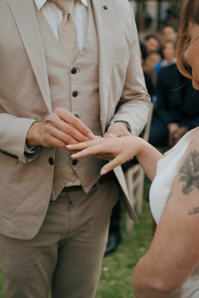 bride and groom exchanging rings during their wedding ceremony in Cyprus