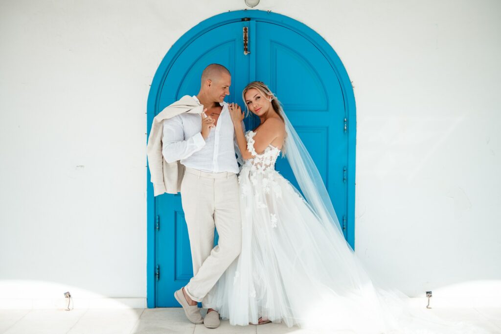 Bride and groom intimate wedding photoshoot at the iconic blue door of Ayia Thekla Chapel in Cyprus