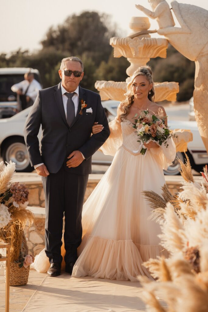 bride walking down the aisle at Saint Epifanios church in Cyprus
