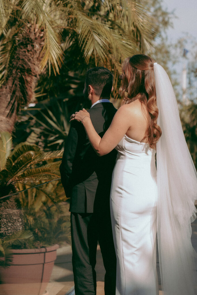 Bride and groom having their first look in the gardens of Four Seasons Hotel Limassol