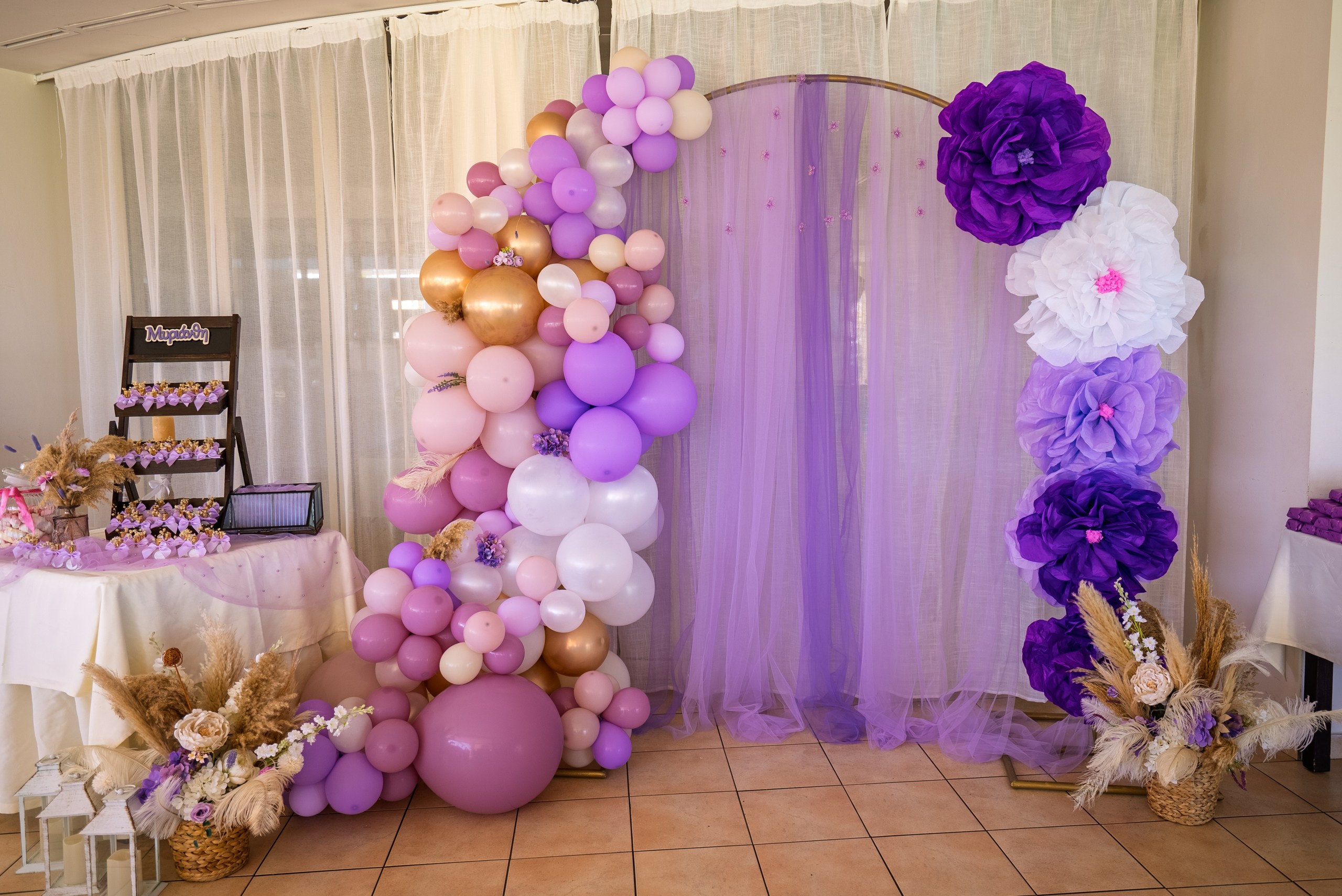 custom made purple balloon arch for a girls christening in Polyxenia Isaac restaurant Pernera