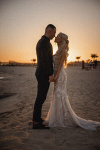 Luxury beach wedding couple at Sirens Beach wedding venue, romantic destination wedding photography.